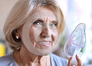 Elderly woman with an inhaler