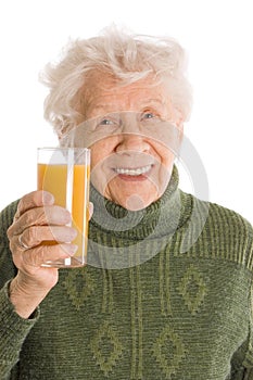 Elderly woman with a juice glass