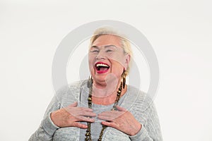 Elderly woman laughing isolated.