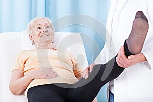 Elderly woman during leg rehabilitation