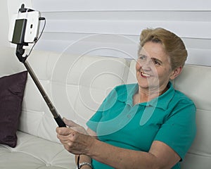 Elderly woman making self-photos