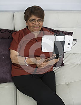 Elderly woman making self-photos