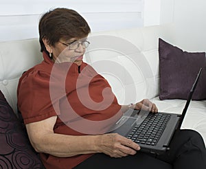 Elderly woman making self-photos