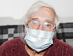 Elderly woman in a medical mask
