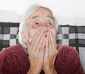 Elderly woman in a medical mask