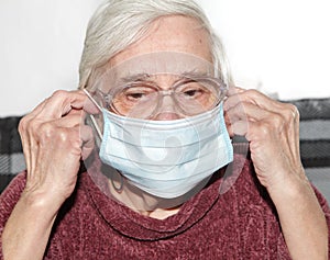 Elderly woman in a medical mask