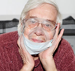 Elderly woman in a medical mask