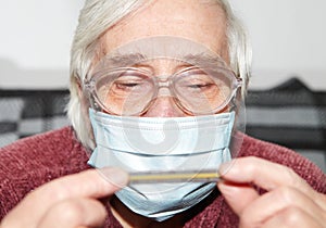 Elderly woman in a medical mask. The epidemic