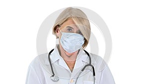 Elderly woman in a medical mask with a stethoscope on white background.