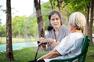 Elderly woman or mother with depressive symptoms or alzheimer patient,asian female caregiver or daughter holding elderly patient