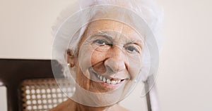 Elderly Woman Old Lady Relaxing On Rocking Chair At Home