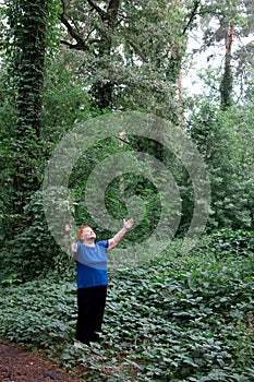 Elderly woman park flowers hands bouquet green nature meditatio