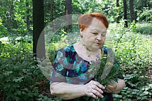 Elderly woman park summer with flowers hands seniors grandma