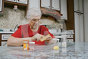 Elderly woman and pills