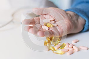 Elderly woman with pills hand, grandmother with medicines