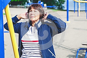 Elderly woman playing sports in street simulator