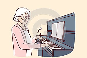 Elderly woman plays piano and smiles, rejoicing at presence of creative musical hobby