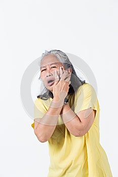 Elderly woman pose in a painful on her body