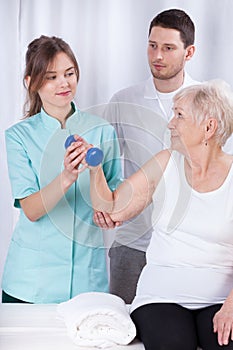 Elderly woman practicing during rehabilitation