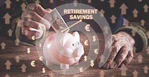 Elderly woman putting money to piggy bank. Retirement Savings