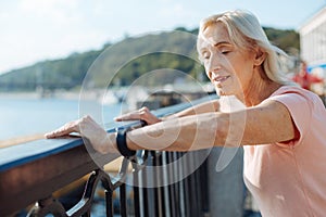 Elderly woman resting after a morning run