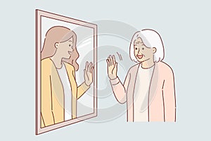 Elderly woman sees past in reflection of mirror, and waves hand, receiving positive emotions