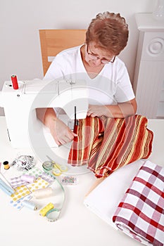 Elderly woman sewing
