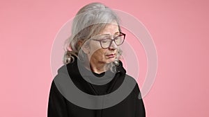 Elderly Woman Showing Embarrassment, Averts Eyes, Pink Tone