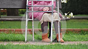 Elderly Woman Sitting Alone on Park Bench