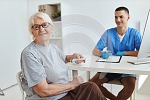 elderly woman sitting in the doctor& x27;s office visit to the hospital