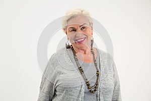 Elderly woman smiling isolated.