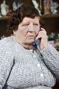 Elderly woman speaking at phone