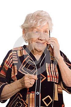Elderly woman speaks on the phone