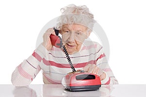 Elderly woman speaks on the phone