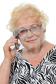 Elderly woman speaks on phone