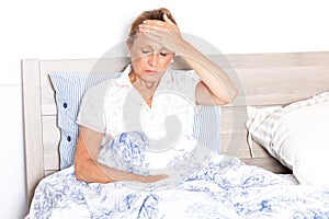 Elderly woman suffering from headache