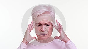Elderly Woman Suffering from Headache on White Background