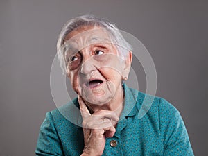 Elderly woman with surprised expression