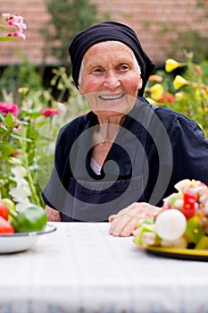 Elderly woman at the table