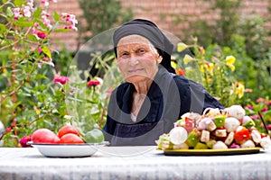 Elderly woman at the table