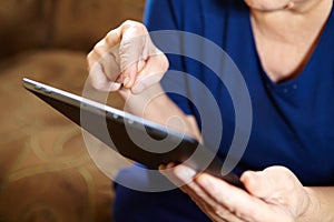 Elderly woman with tablet computer