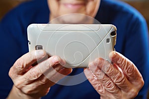 Elderly woman with tablet computer