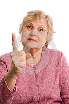 The elderly woman threatens with a finger