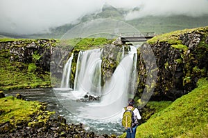 Elderly woman -  traveler with a large backpack