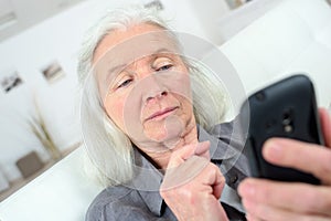 Elderly woman using cellphone