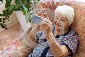 Elderly woman using smartphone