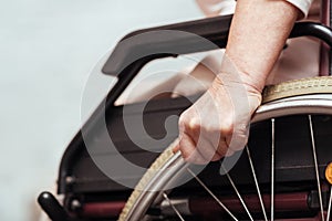 Elderly woman using wheelchair.