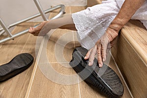 Elderly woman with walker falling down stair