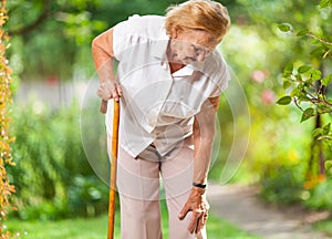 Elderly woman with a walking stick
