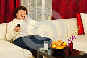 Elderly woman watch tv in living room